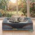 Cat sleeping on a Pets Gear cat bed in a bright room with plants