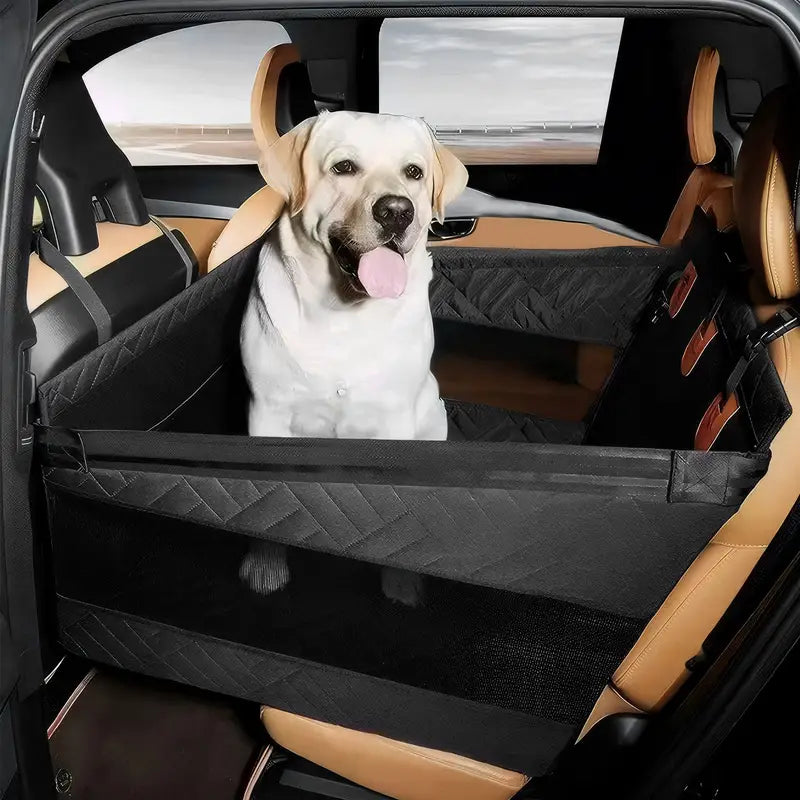Labrador safely sitting in a large dog car seat protector